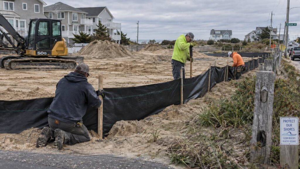 Silt fence installation crew working a construction site near Toms River, NJ